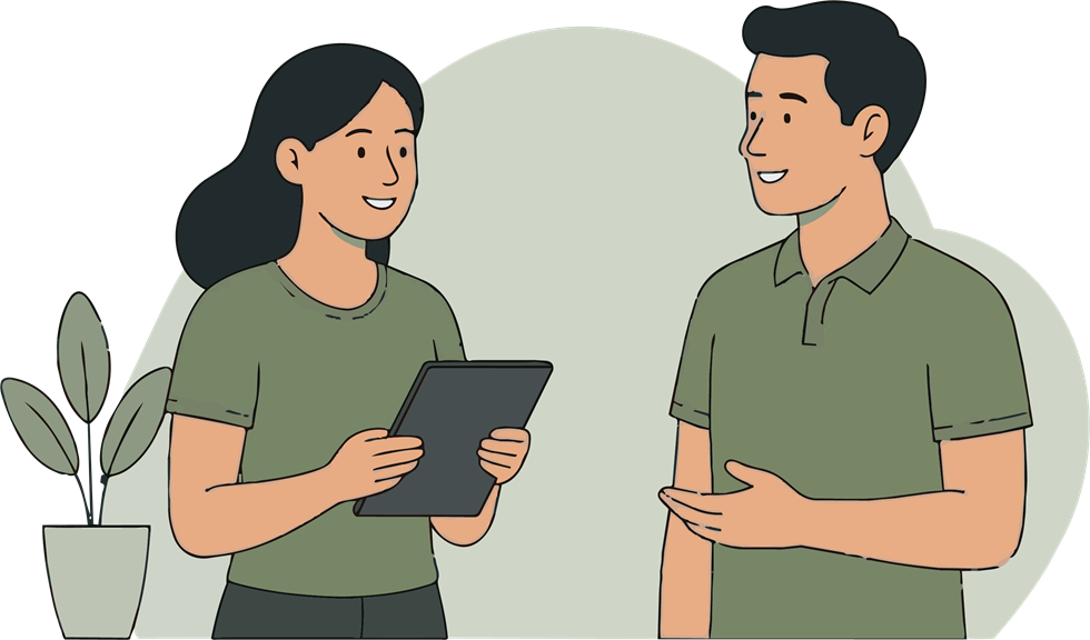 Manual therapist reviewing care with a client using a tablet.