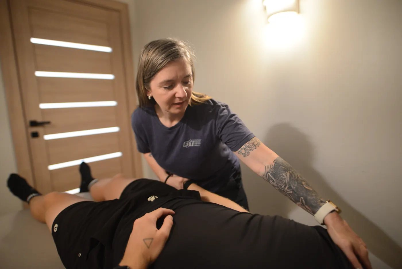 Provider guiding movement-focused soft tissue and mobility care at 100% Chiropractic Austin Rosedale.